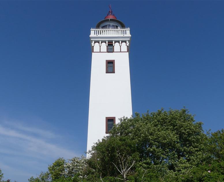 At the head of Strib Odde is the 21 meter high, whitewashed Strib Lighthouse